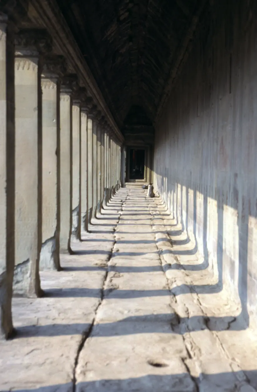 An outside corridor at Angkor Wat, the most majestic of the many temples in the ancient city of Angkor, Cambodia. This temple was built by the rulers of the Khmer people over eight centuries ago as a dedication to the Hindu god Vishnu.