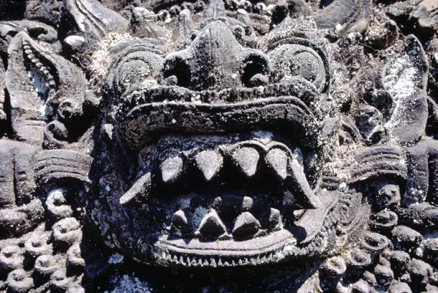 A carving guards the entrance to a temple in Bali.