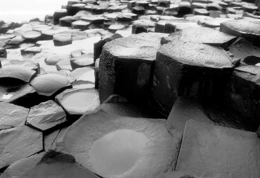 The unusual rock formations of the Giant's Causeway in Northern Ireland, a mass of 40,000 basalt columns created by cooling lava.