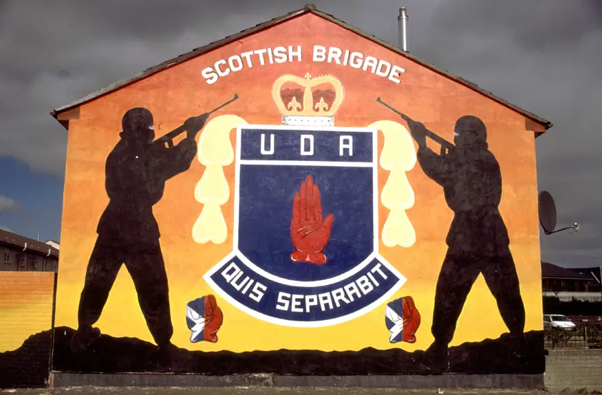 Mural in Protestant Shankill Road area of Belfast honoring the Scottish Brigade of the Ulster Defence Association. The UDA is the largest Loyalist paramilitary organization in Northern Ireland.
Inscription reads, ""Scottish Brigade / UDA / Quis Separabit""