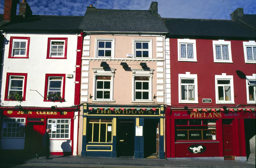 Three traditional Irish pubs sitting side by side in the quaint town of Kilkenny.
