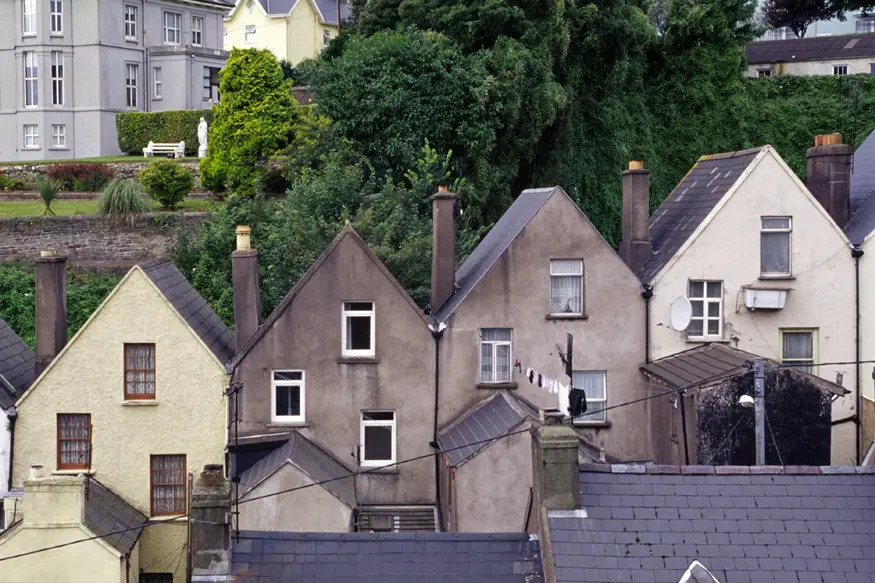 Rowhouses rise up a hill in Cobh, County Cork.