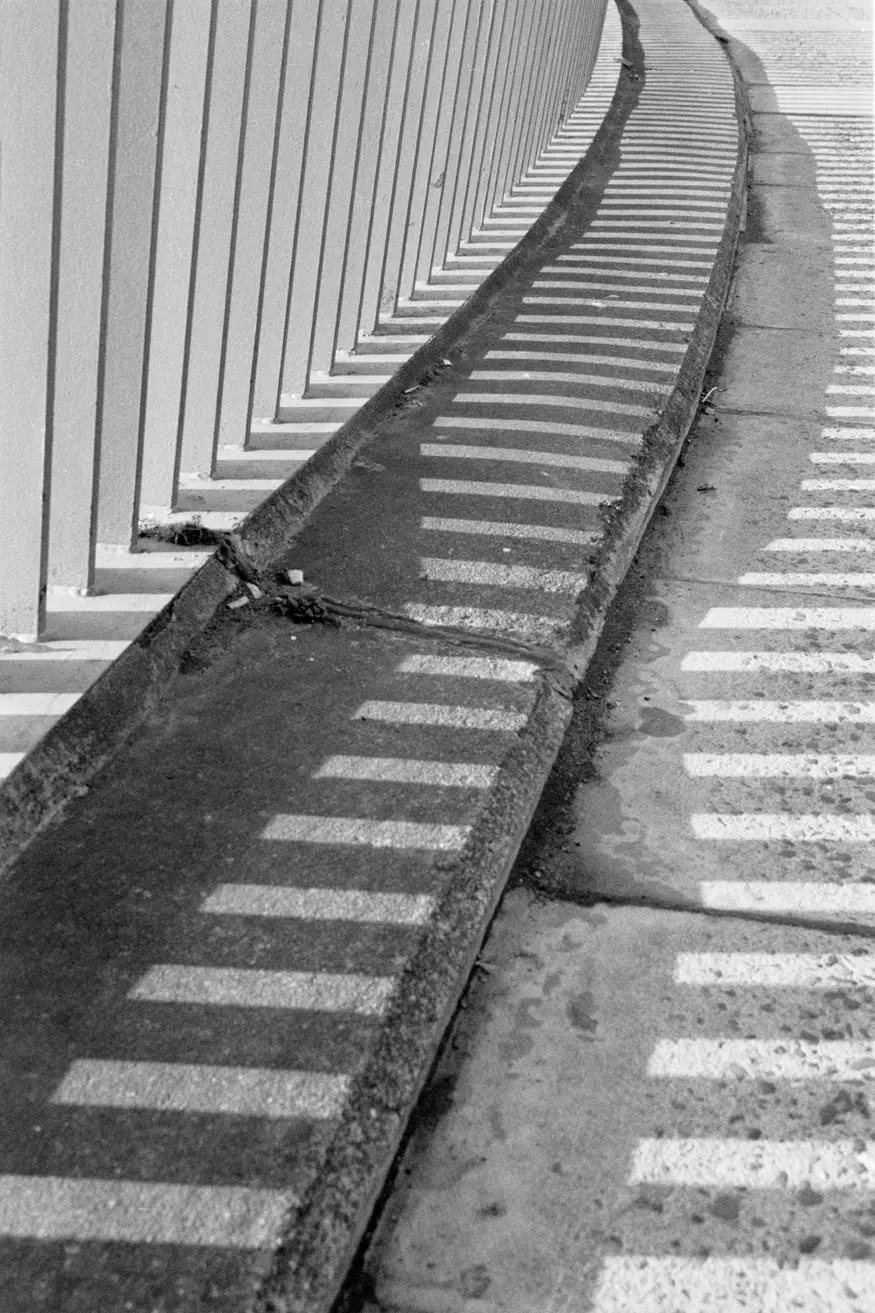 Shadows fall over the sidewalk in the city of Cork.