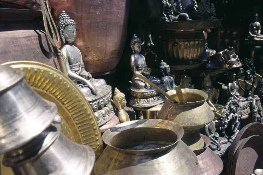 A collection of brass Buddhas and other religious items for sale in Kathmandu.