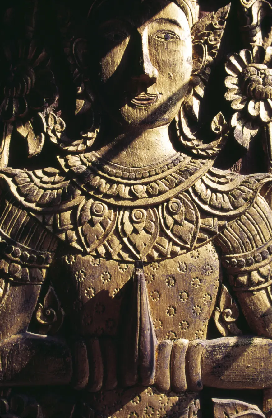 An intricate carving adorns a door in the northern Thai temple of Wat Phra Singh (1343 AD), also known as Wat Lee Chiang Phra.