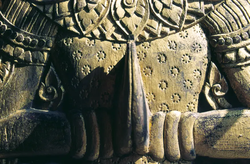 An intricate carving adorns a door in the northern Thai temple of Wat Phra Singh (1343 AD), also known as Wat Lee Chiang Phra.