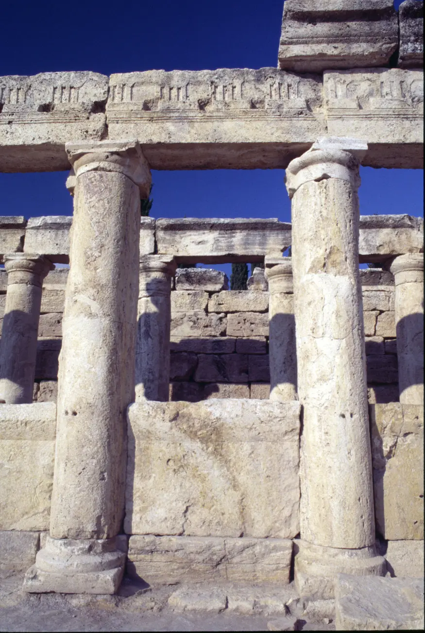 Ruins on Frontinus Street in the ancient Roman spa city of Hierapolis, near Pamukkale, Turkey. The area was established around 190 BC for its warm carbonated curative waters and it is believed that St. Phillip was martyred in the city in 80 AD.