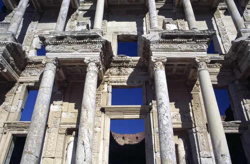 Looking up at the Library of Celsus, a monument and library erected in 114 AD by the Roman leader Tiberius Julius Aquila in honor of his deceased father, Tiberius Julius Celsus Polemaeanus. At its peak, this library held up to 12,000 scrolls.