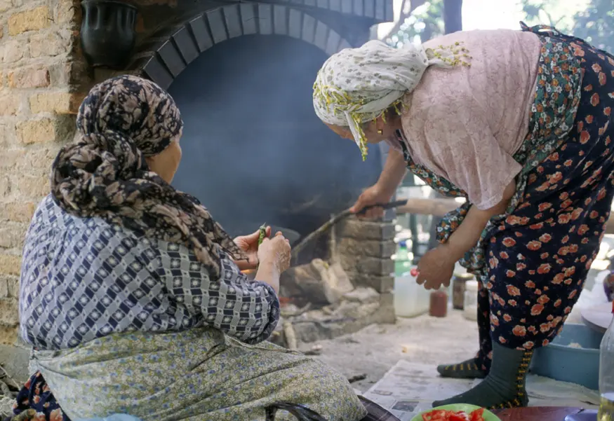 Two Turkish women cook a stuffed pancake-like dish in a wood stove. My feta and spinach order was very similar to a quesadilla or papusa.
