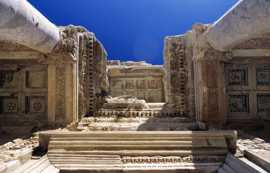 Looking up at the Library of Celsus, a monument and library erected in 114 AD by the Roman leader Tiberius Julius Aquila in honor of his deceased father, Tiberius Julius Celsus Polemaeanus. At its peak, this library held up to 12,000 scrolls.