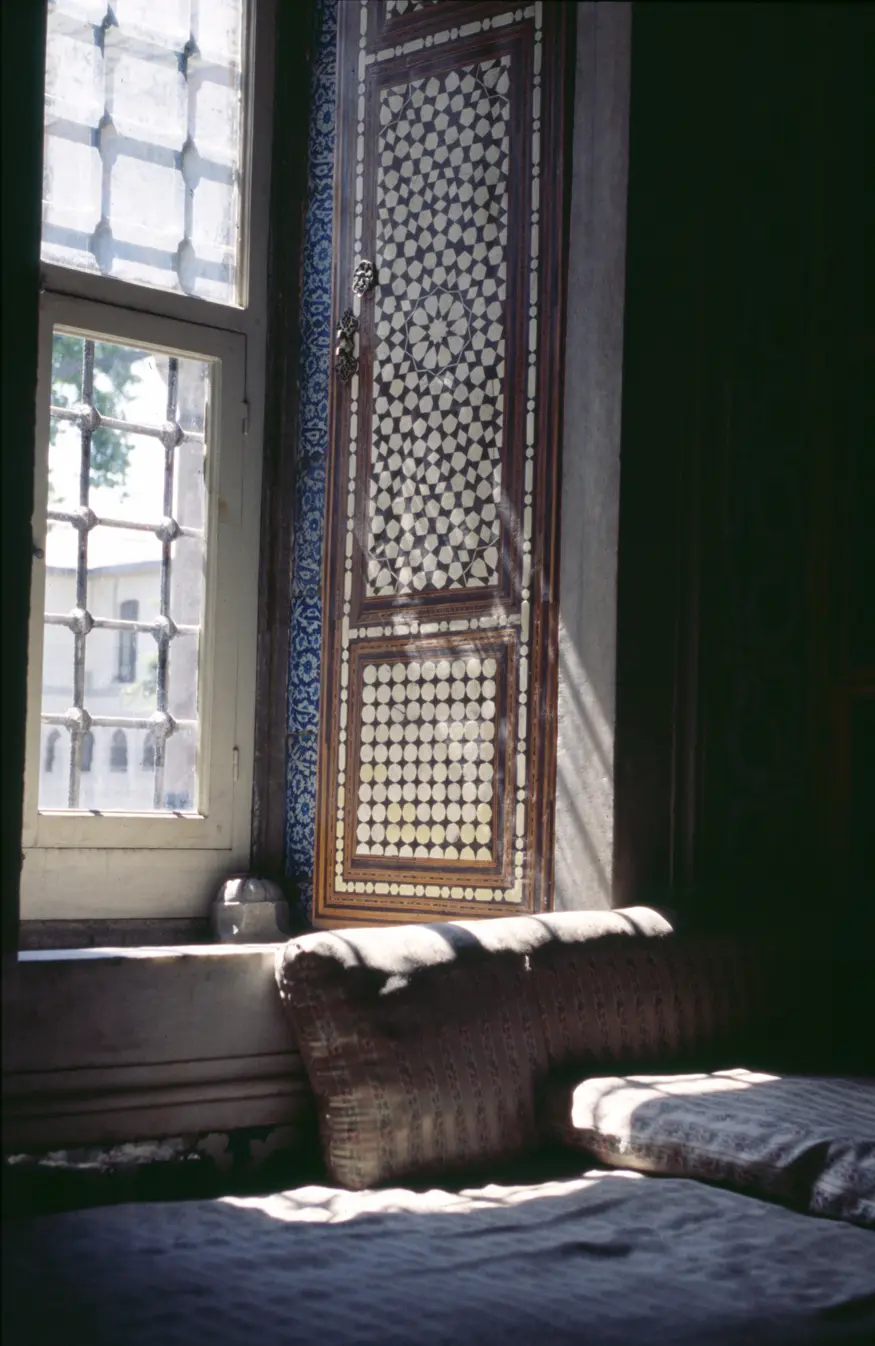 Sun filters across Turkish tile work and mother-of-pearl doors in the Topkapi Palace, Istanbul's home of the sultans.