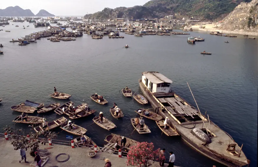 Off in the distance, a city floats on the water in Halong Bay, northern Vietnam.